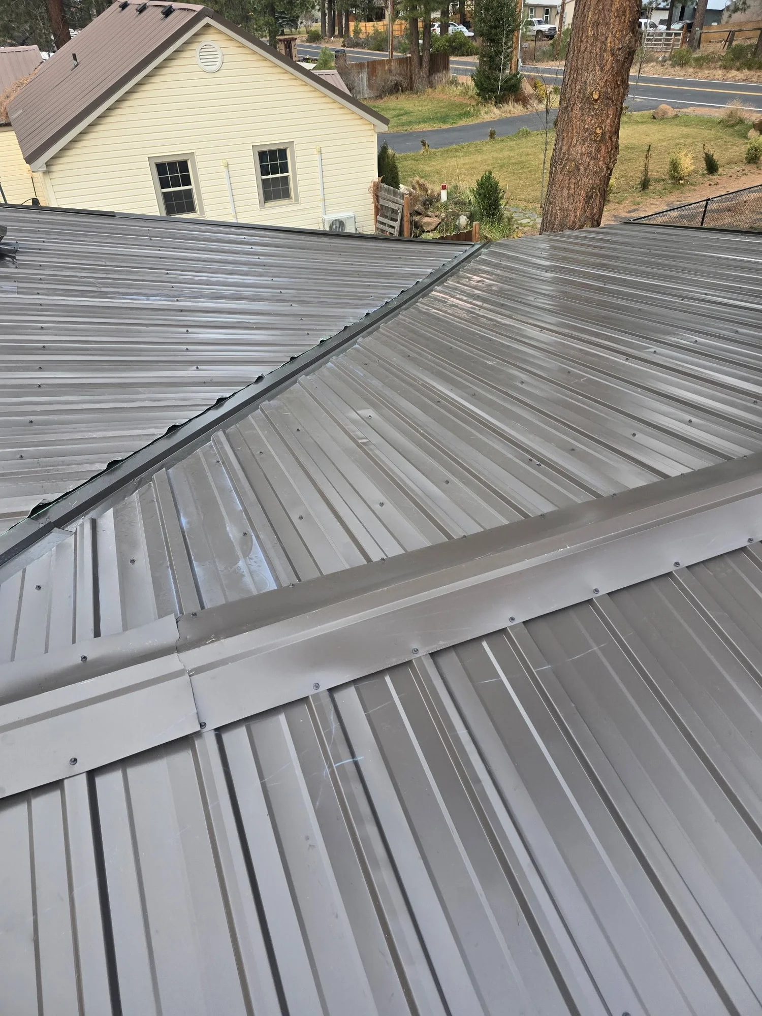 Metal roofing and roof transitions